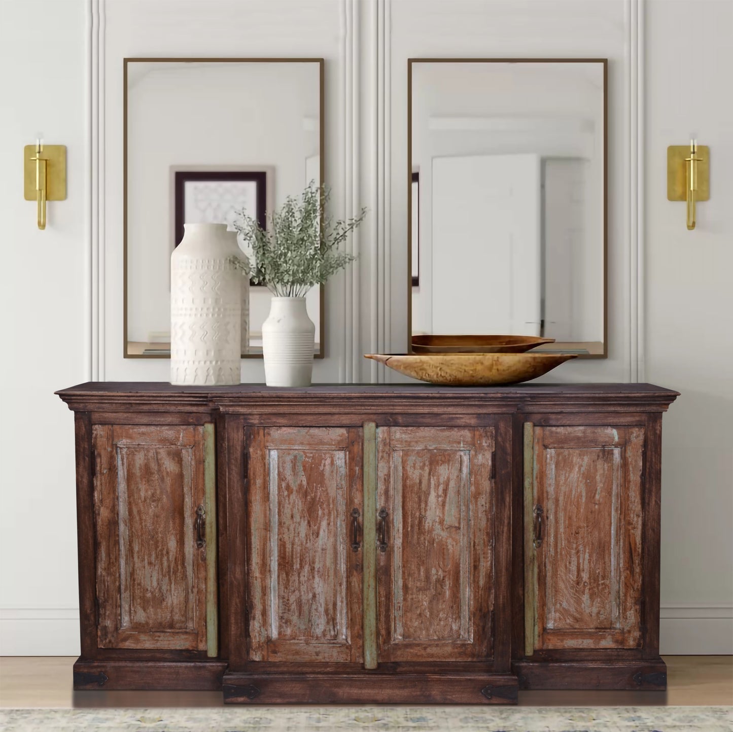 Decorated natural finish sideboard with vase.