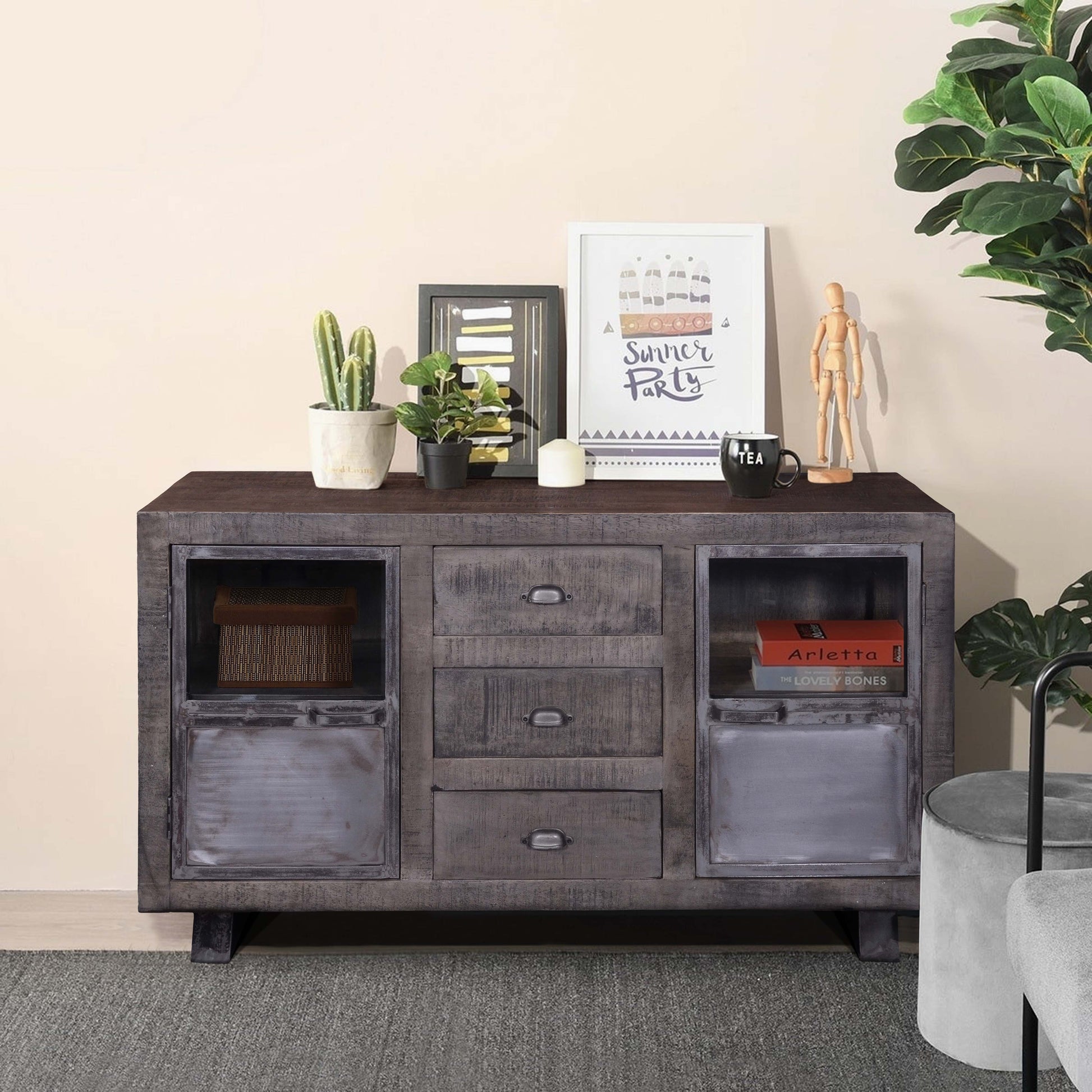 Mango wood sideboard in a ozy room setting.