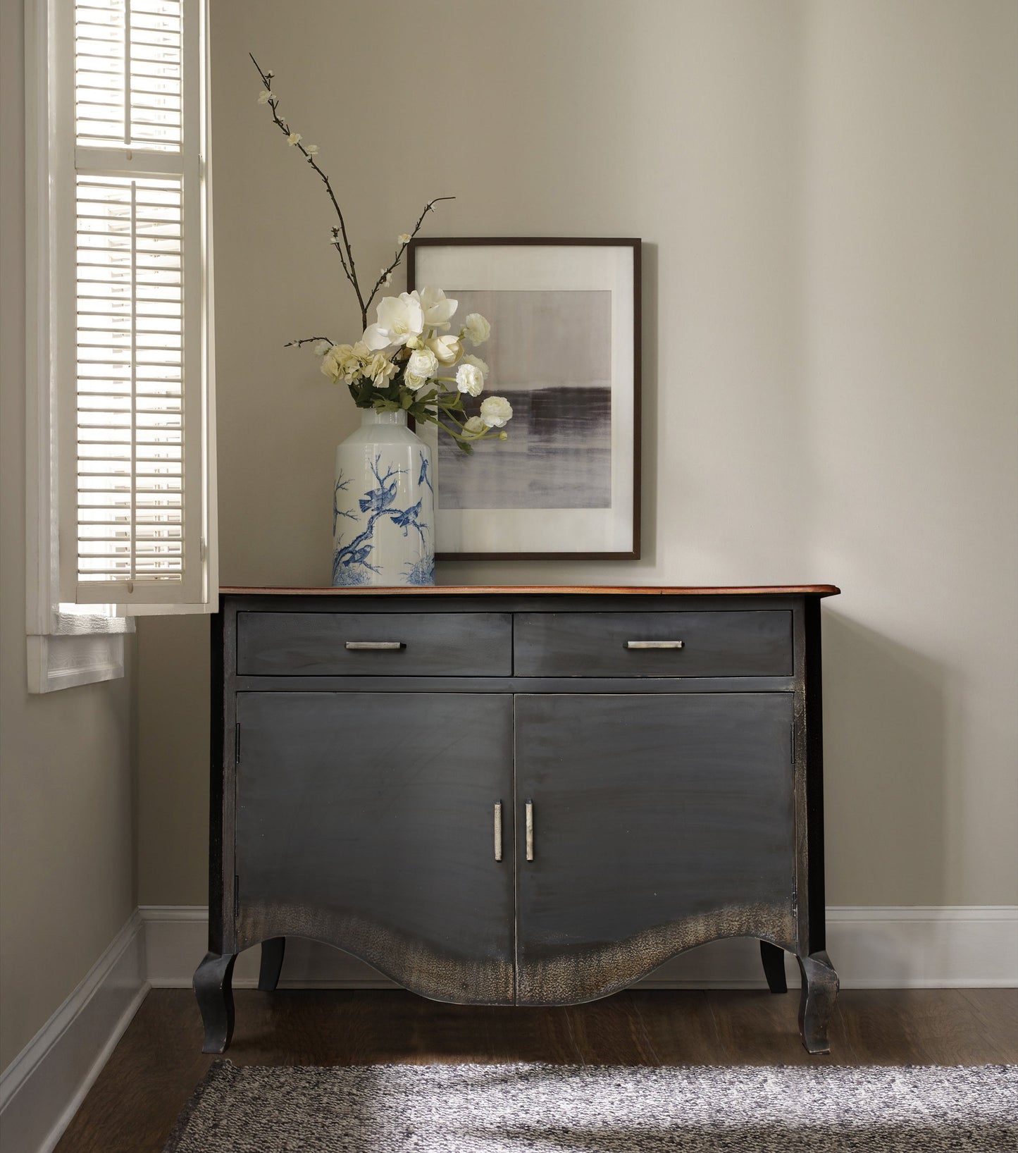 Amia Two Drawer Cabinet with mirror and plant.