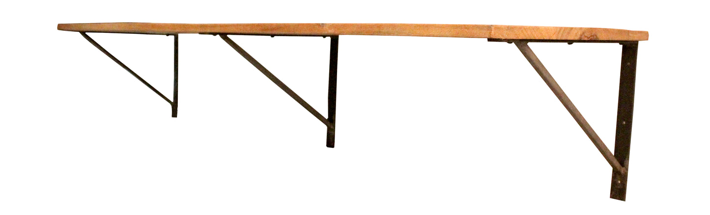Side angle view of the wooden shelf with iron brackets.
