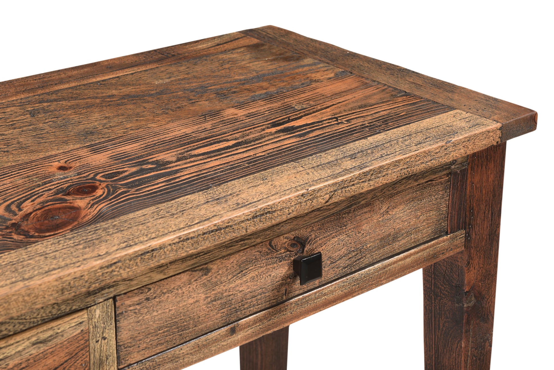 Close-up of sofa table’s detailed wooden craftsmanship.