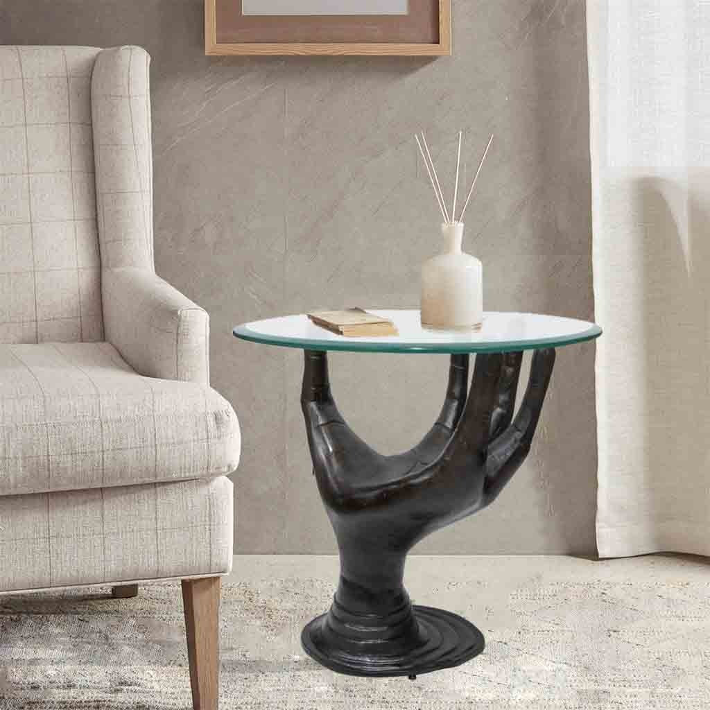 Stylish palm table placed next to a sofa