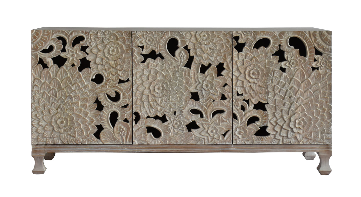 Front view of a carved wooden chest.