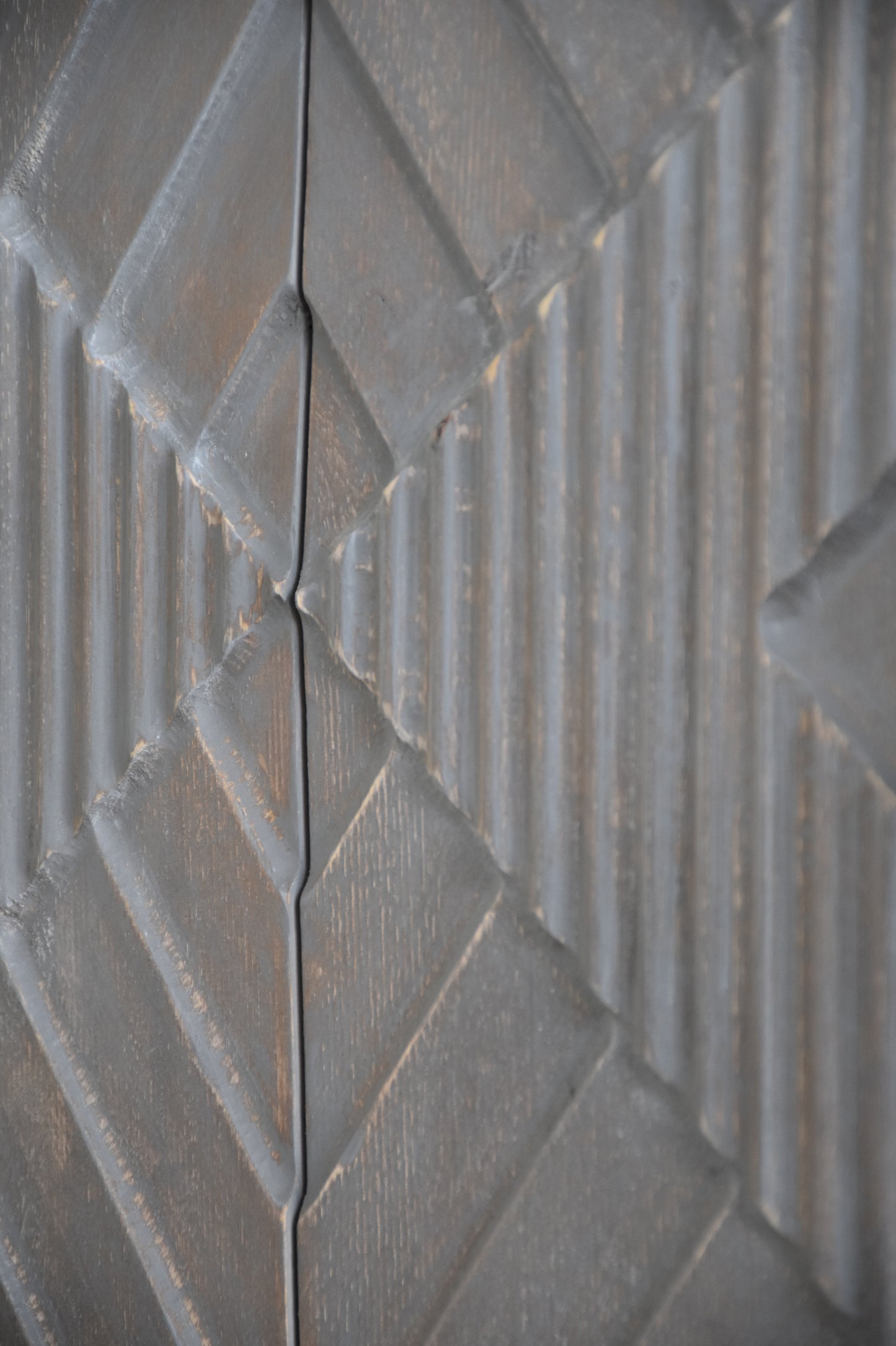 Close-up of the sideboard's textured wooden finish.