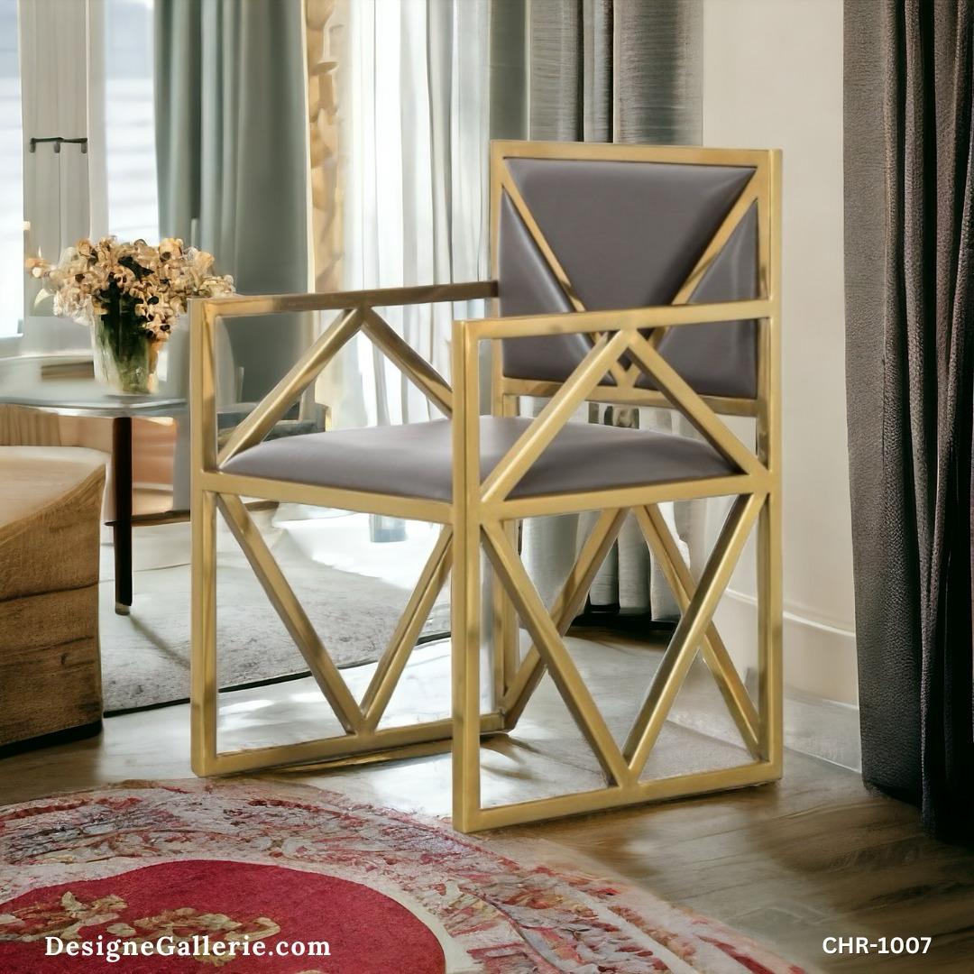 Elegant gold-framed chair in a stylish interior setting.