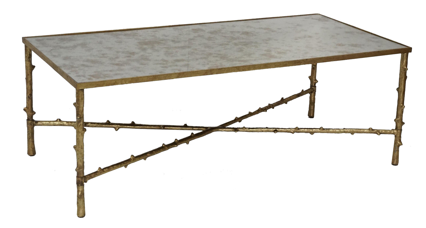 Side view of elegant coffee table with gold accents.
