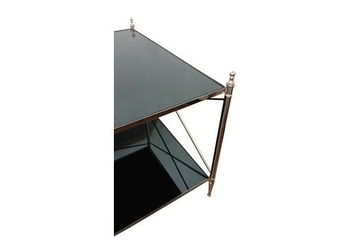 Close-up of glass and metal coffee table.