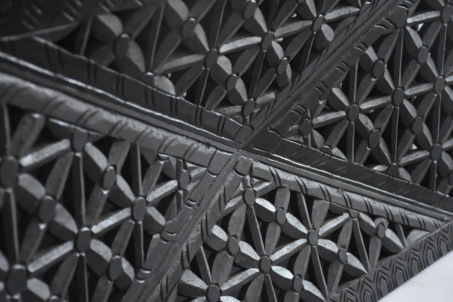 Detailed lattice design on coffee table.