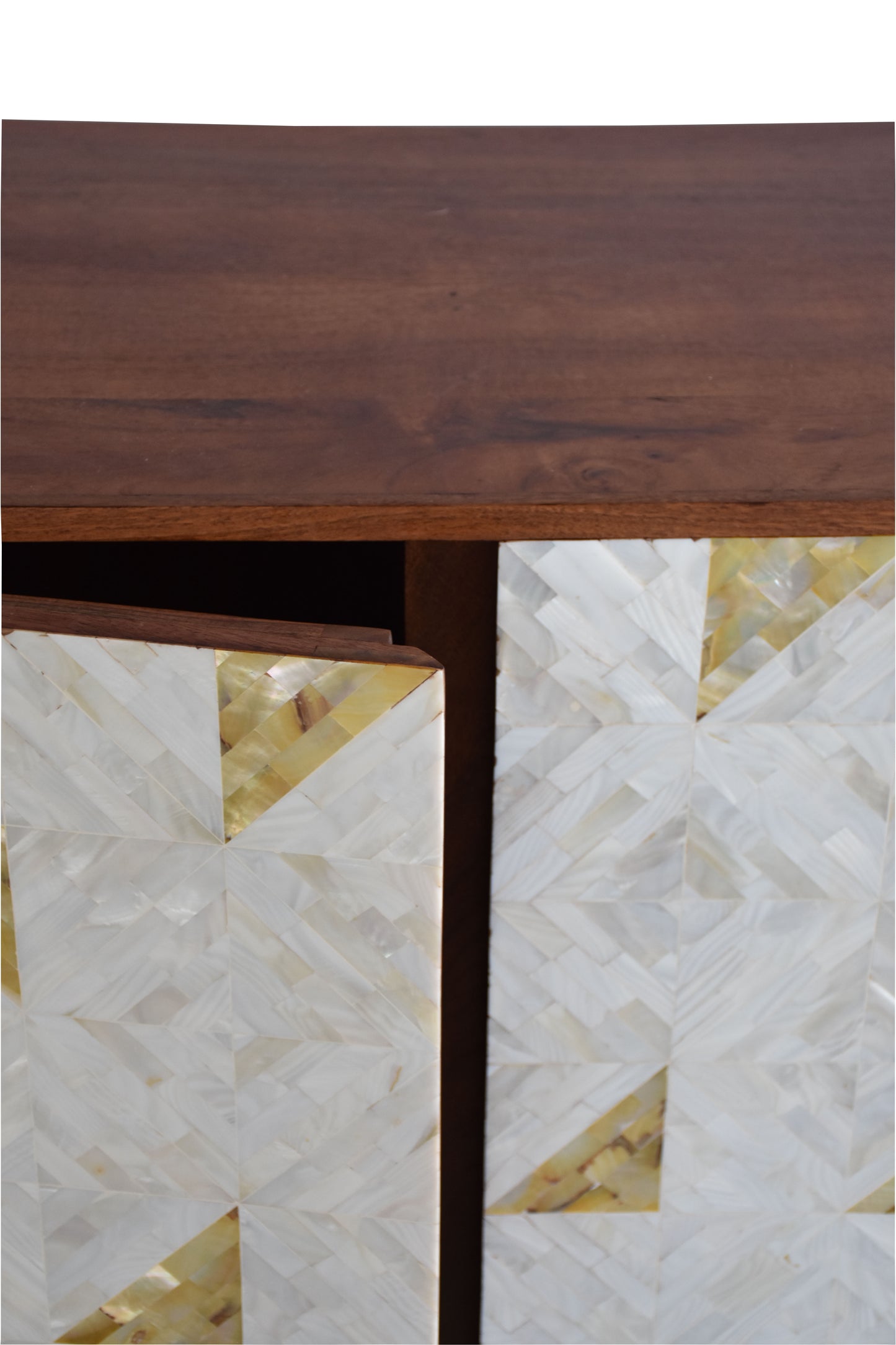 Close-up of intricate Mother of Pearl inlays on cabinet.