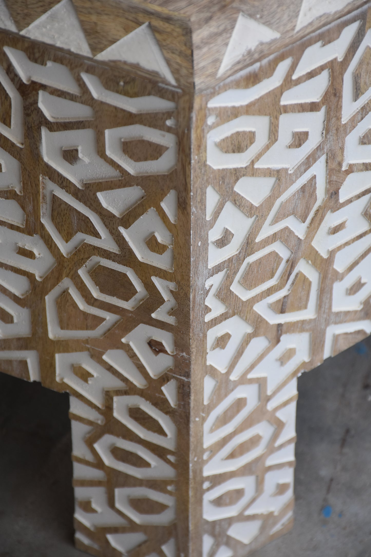 Close-up of coffee table leg.