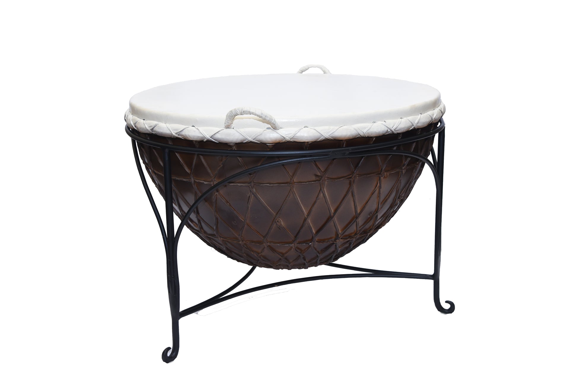 Side view of a drum coffee table with iron legs.