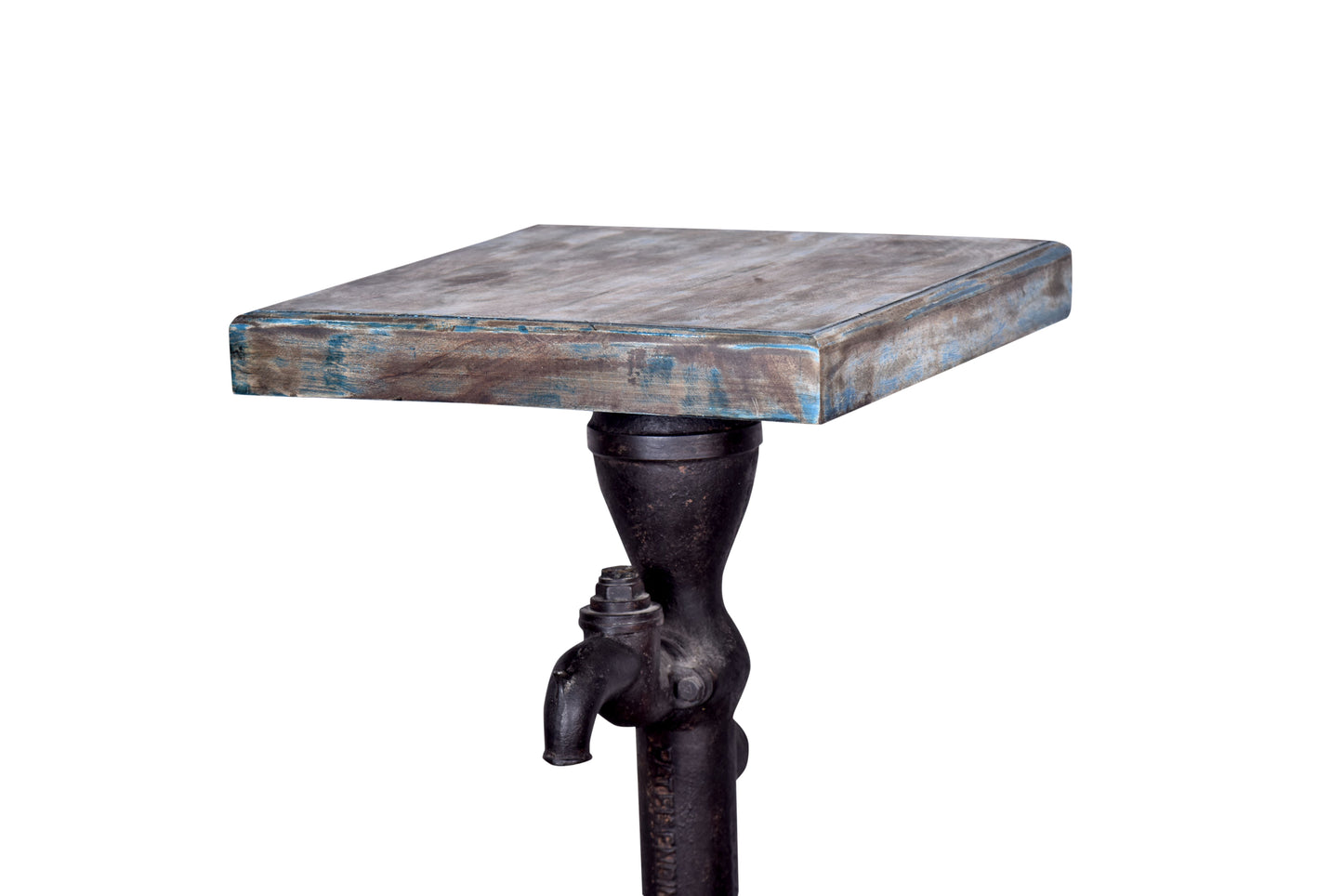 Close-up of the wooden base of the hand pump plant stand.