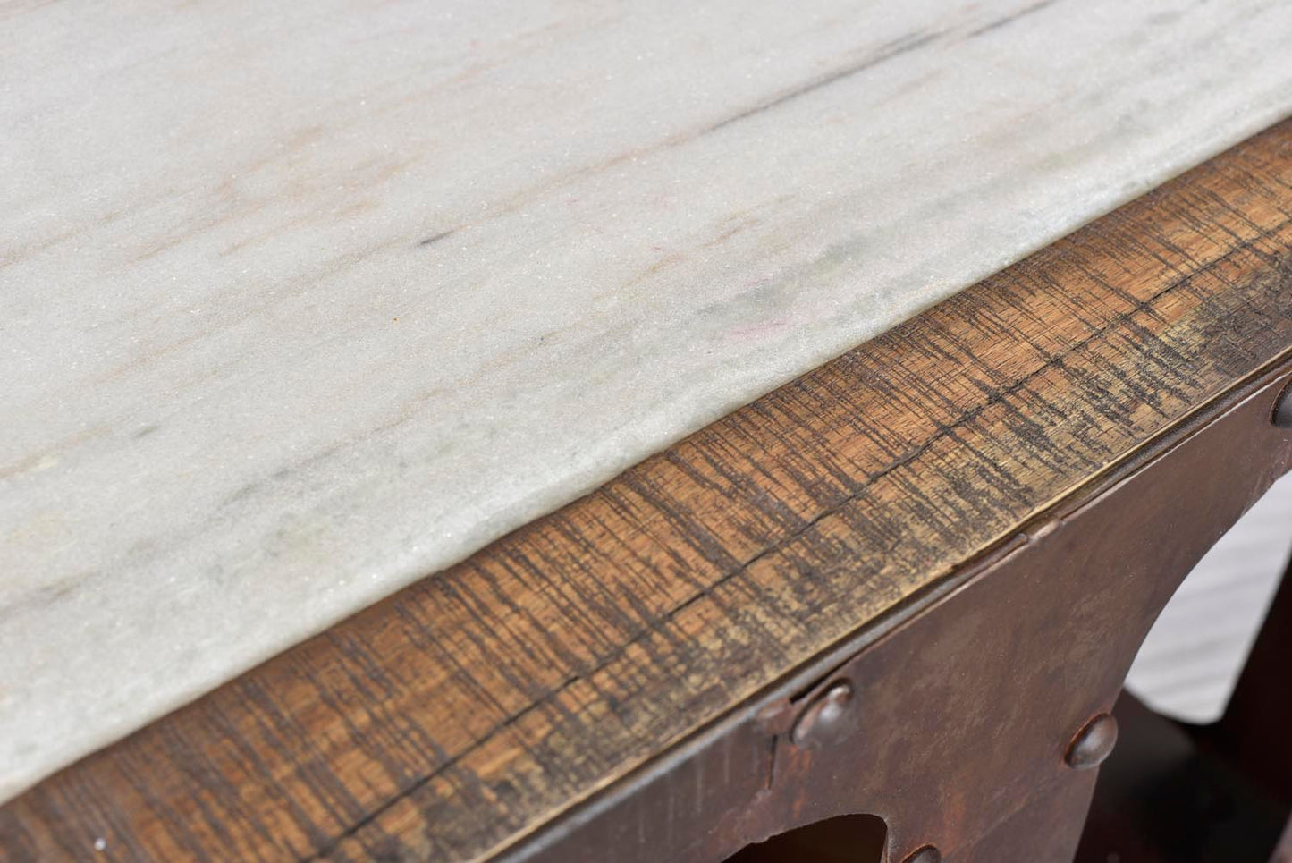 Close-up of marble top on end table.
