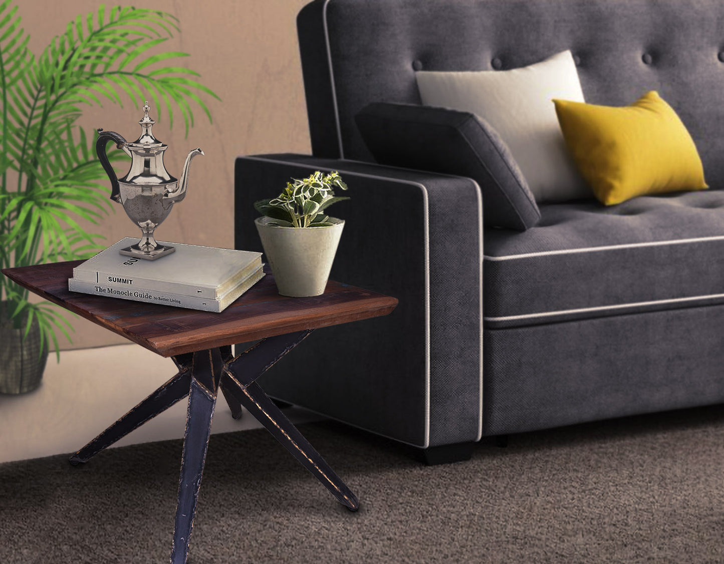 End table styled next to a sofa with a plant and lamp