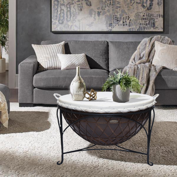 Elegant coffee table with leather and iron base in a living room.