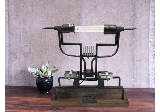 Minimalist shot focusing on lamp’s metal and wood design.