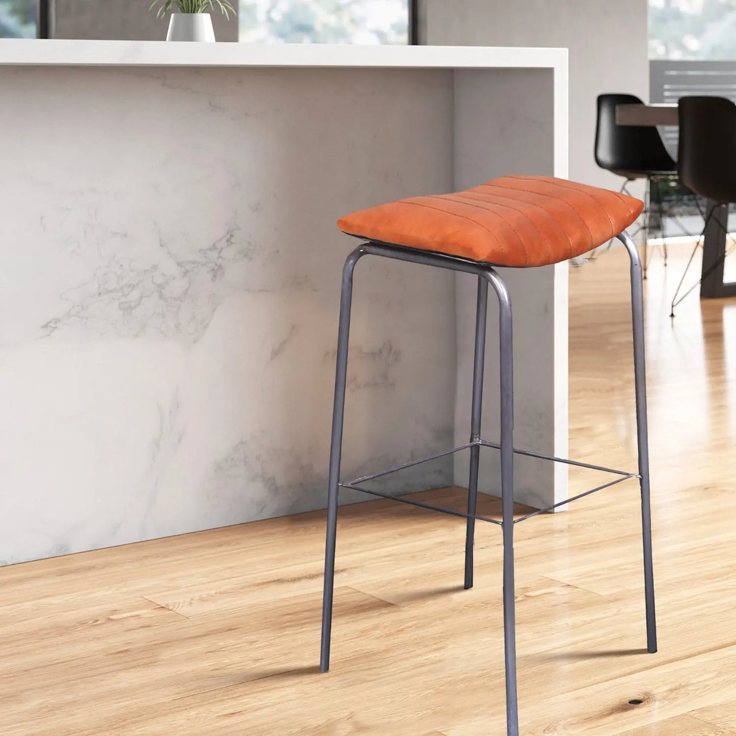Bar stool placed near a modern kitchen counter
