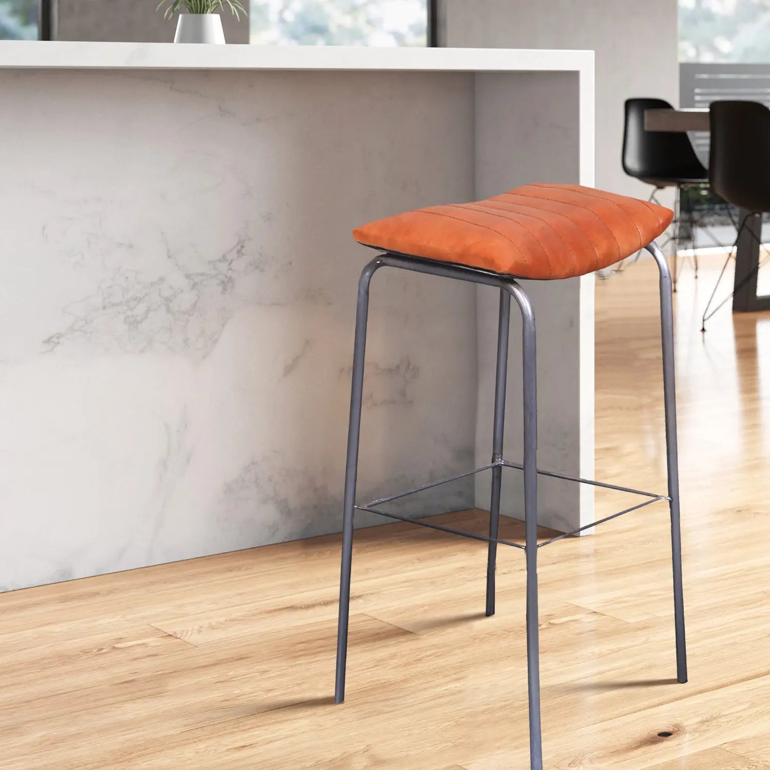 Bar stool placed near a modern kitchen counter