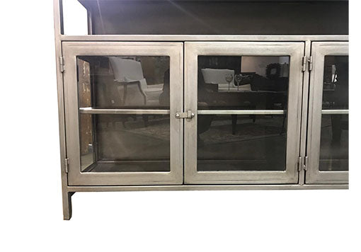 Spacious media console with a mix of open and closed storage.