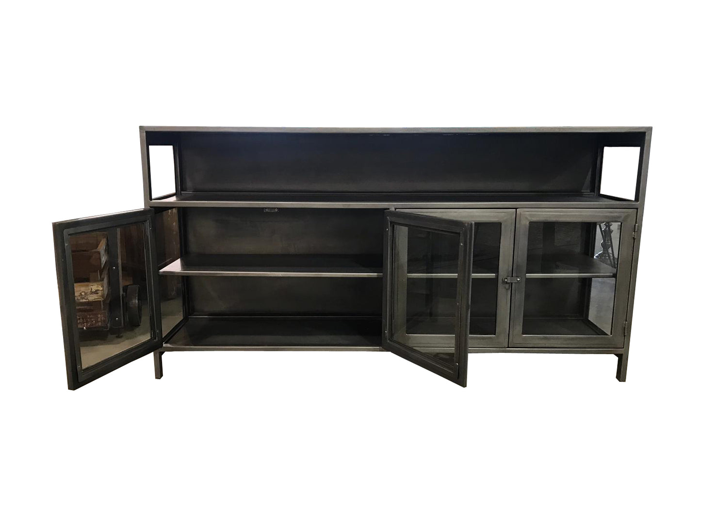 Open storage compartments of a black media console.