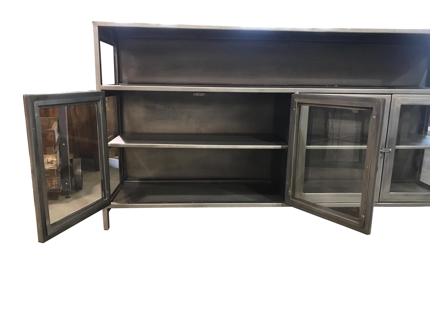 Close-up of storage shelves and glass doors on a media console.