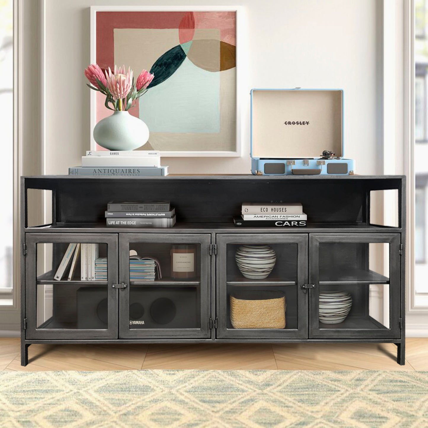 Modern black media console styled in a living room.