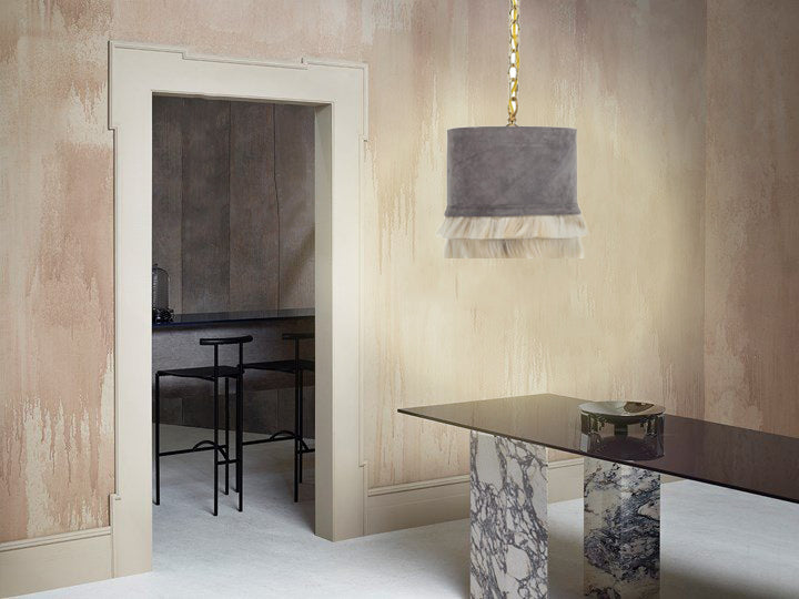 Modern suede and leather lamp with brass accents.