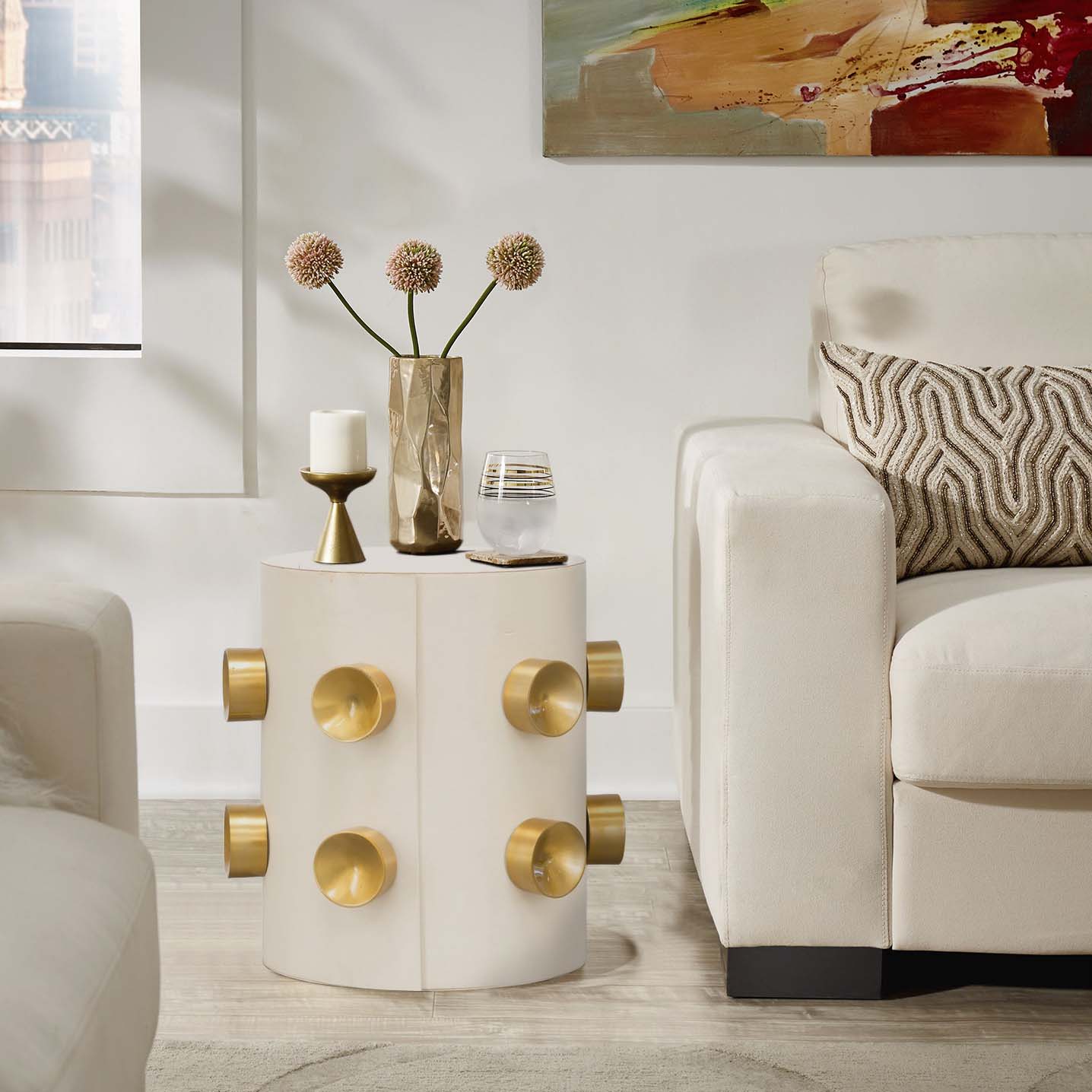 Luxury cream end table with gold accents.