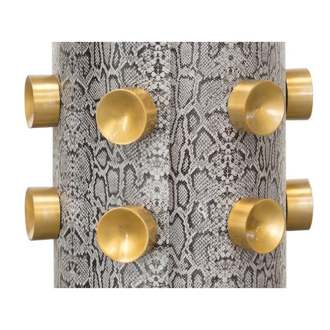 Front view of end table with gold details.
