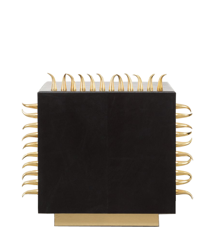 Side view of coffee table with gold spike details.