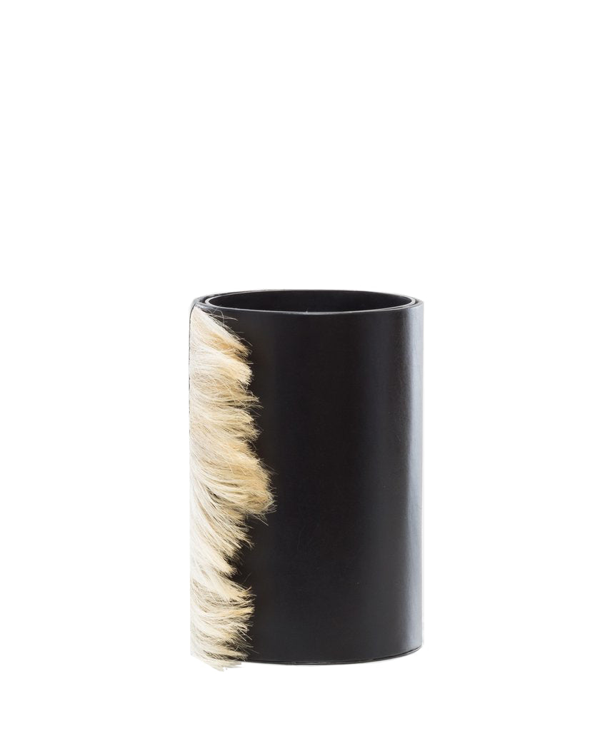 Stylish leather vase for elegant floral displays.