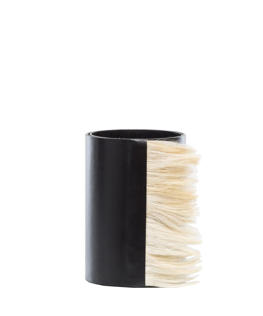 Modern decorative vase with leather and horsehair.