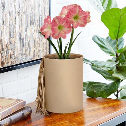 Elegant leather vase with fringes and flowers.